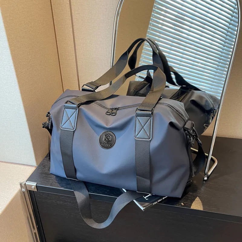 Large black waterproof Oxford cloth travel bag with dry-wet separation compartments.