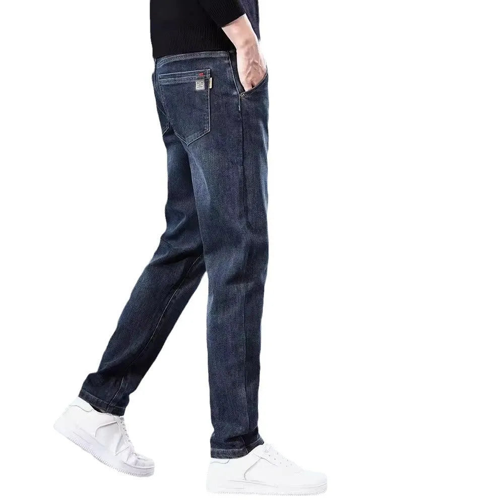 Men's slim straight casual trousers in blue grey, showing loose fit and street style.