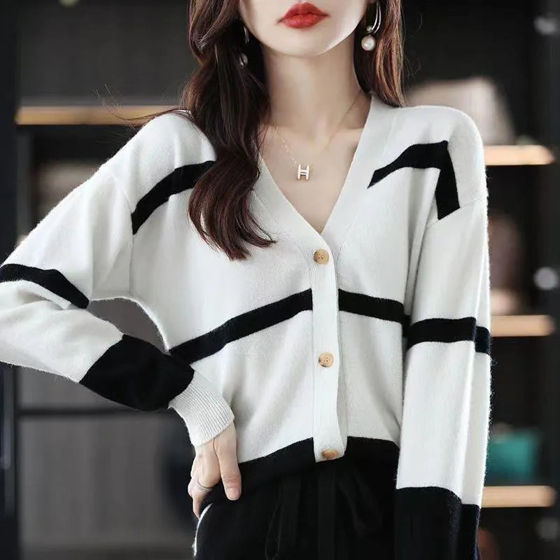 Women's slim fit V-neck cardigan with a raised 3D striped knit pattern in black and white.