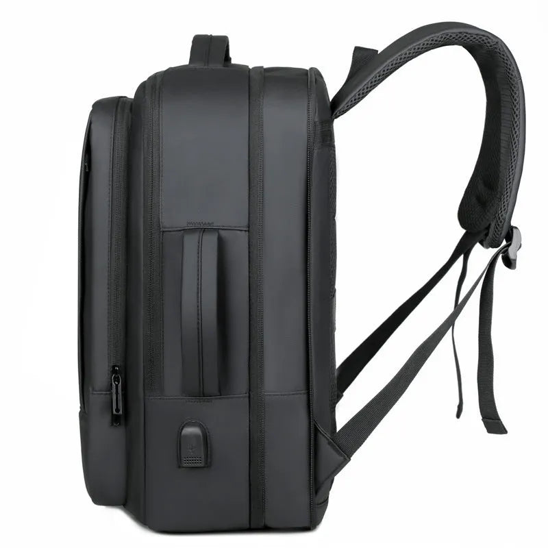 Black Oxford cloth backpack with curved shoulder straps showing business travel styling
