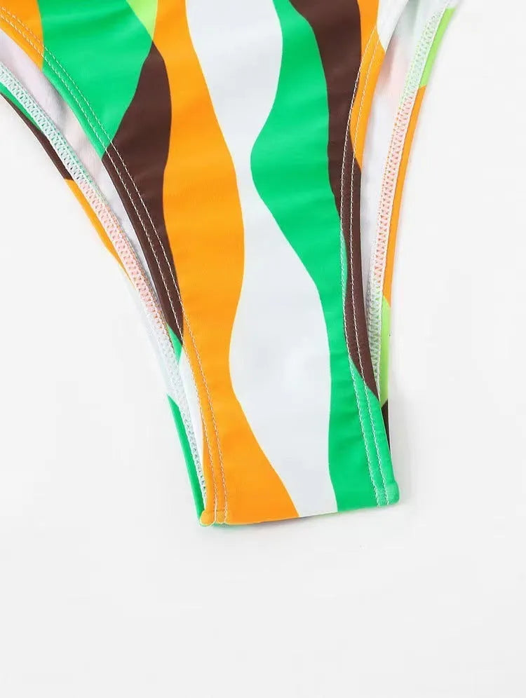 Women's three-piece split swimsuit set with top, briefs, and printed beach skirt in yellow green, magenta, or purple