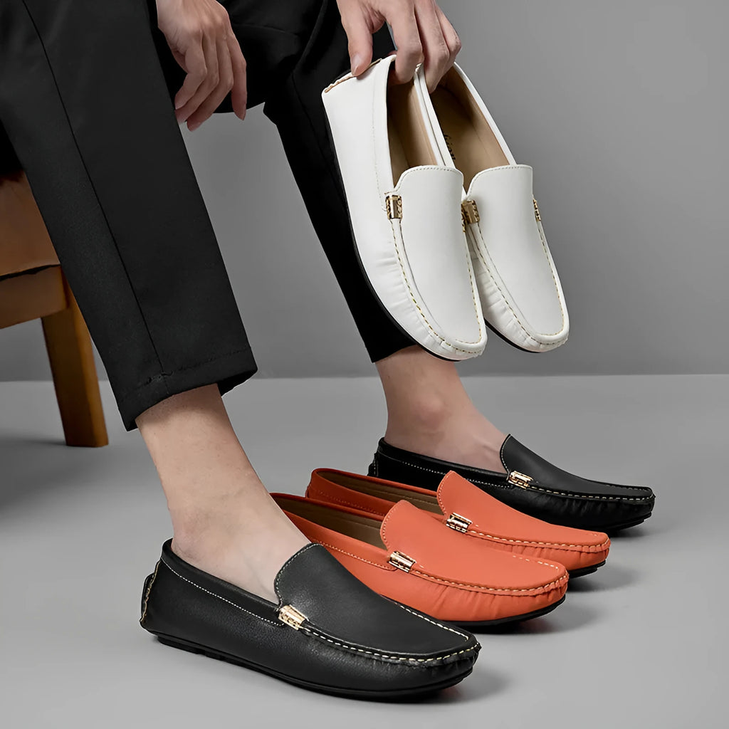 Men's driving shoes in black with matte leather finish, round toe, and flat wedge heel