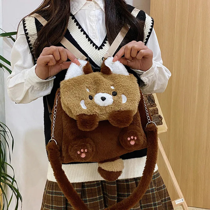 Coati plush cartoon backpack in brown with soft plush exterior and polyester lining, height 26cm, width 27cm