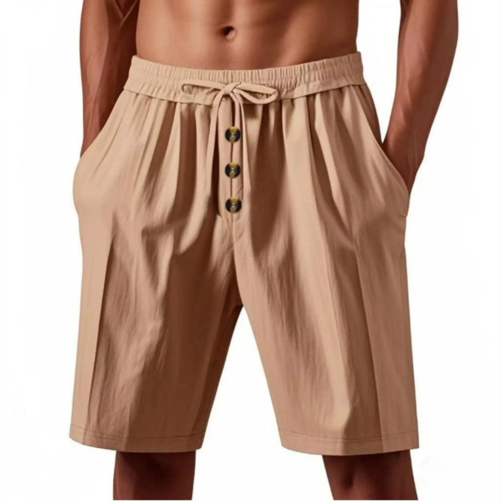 Men's loose straight-leg summer shorts in light khaki, lying flat on a light background