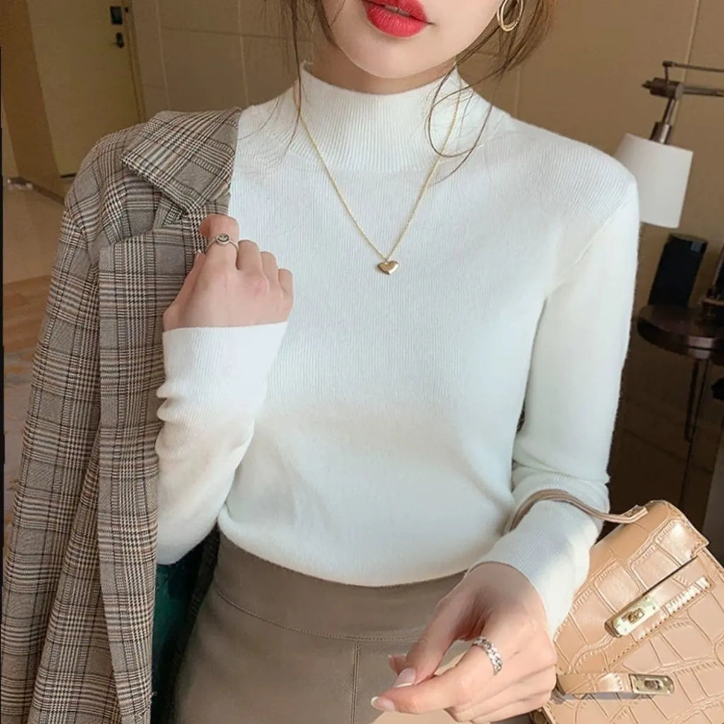 Slim fit knitted viscose shirt in a neutral colour showing long sleeves and pullover design.