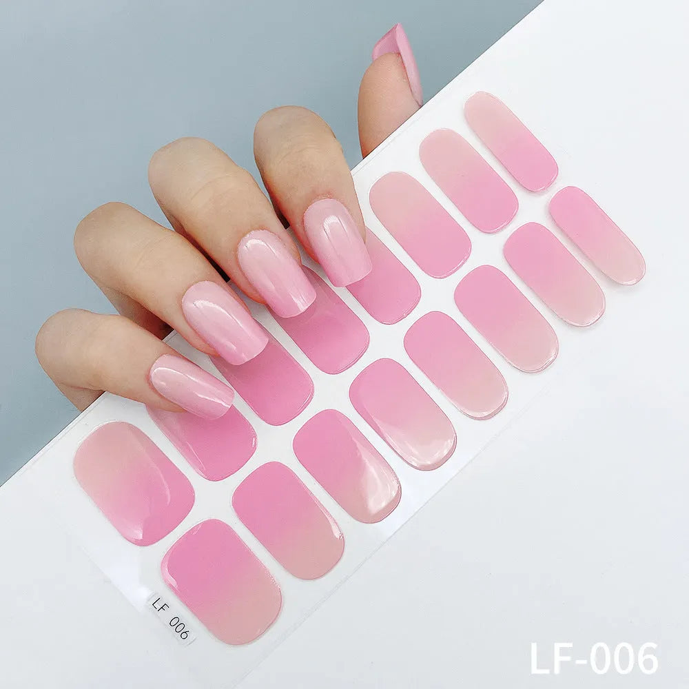 16 solid colour full nail art stickers with 22 patterns including cross, rose, butterfly designs in 12x6mm oval size