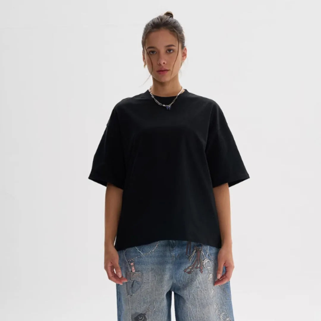 American style loose fit pure cotton T-shirt shown in apricot colour on a model.