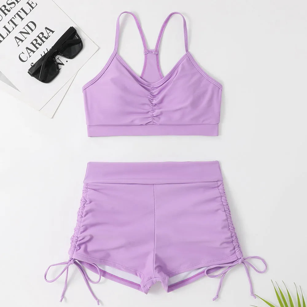 Purple high-waisted split bikini swimsuit for women on a white background.