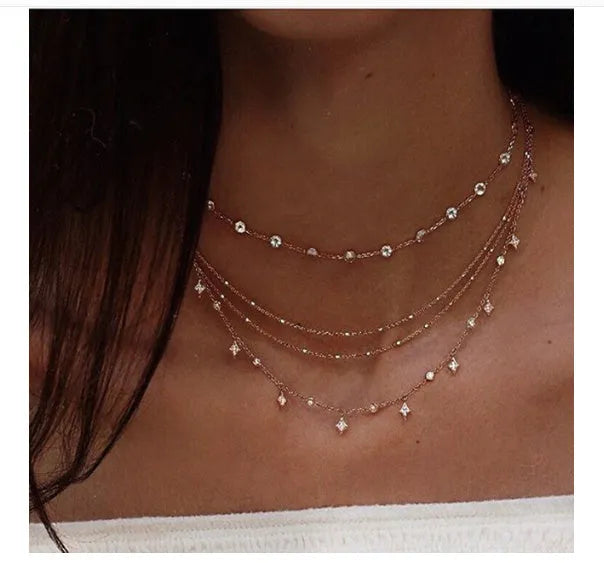 Handmade alloy multi-layer star pendant necklace in gold colour with layered chains and star pendants