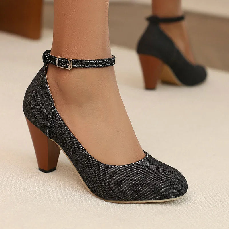 Blue denim women's high heel ankle boots with a buckle strap and thick waterproof platform sole.