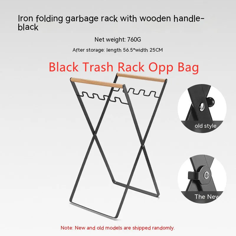 Black folding outdoor trash rack with wooden handle standing on a patio.