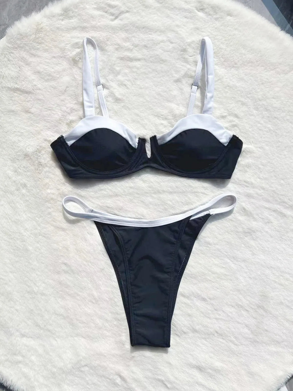 Black low waist women's bikini swimsuit with stitching split design detail