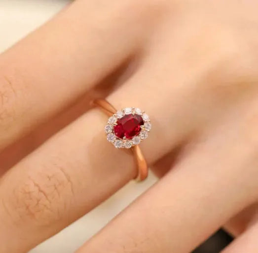 Gold pigeon motif women's ring with red blood ruby artificial gemstone and floral design in silver and gold plating