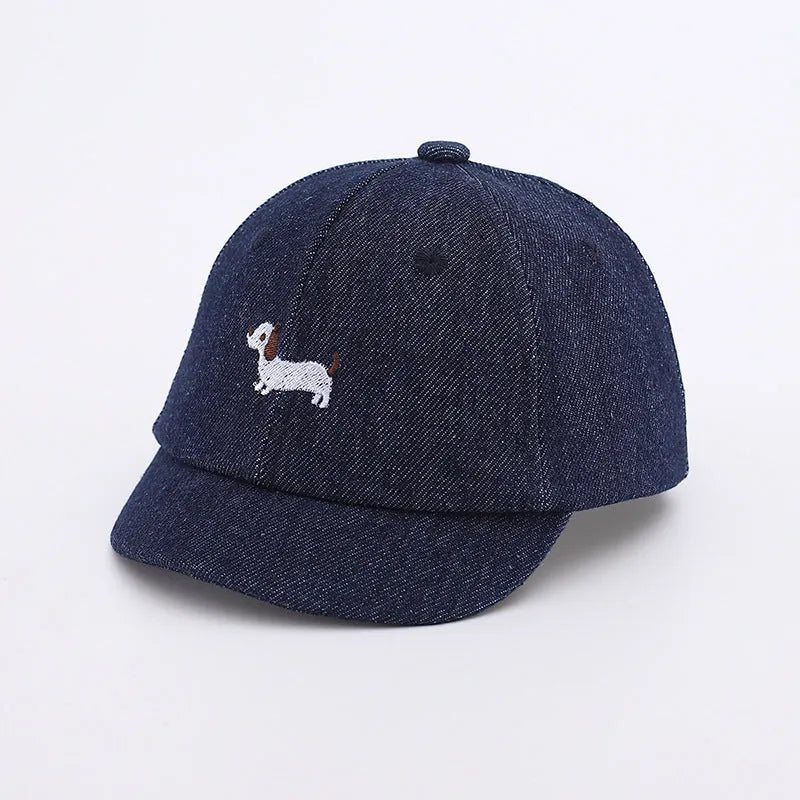 Babies denim puppy baseball cap with short brim and dome crown in light blue, dark blue, or black, 48cm size