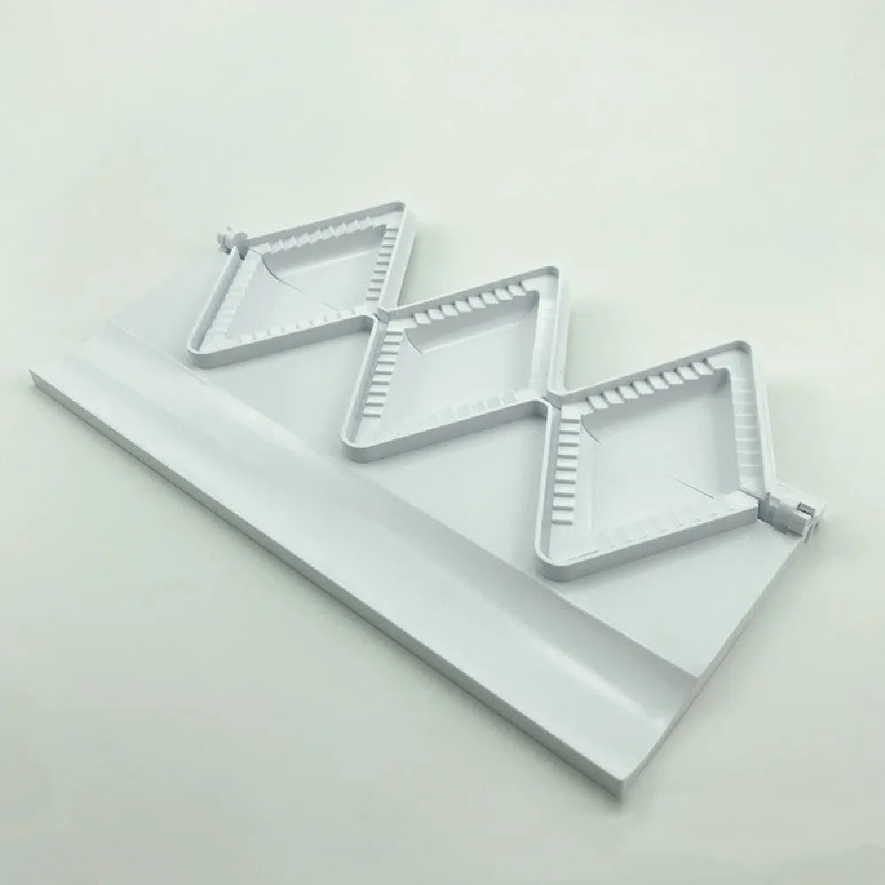 Pure white plastic dumpling maker 28.5cm length on a kitchen counter