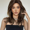 Mid-length curly synthetic wig with long bangs in a gradient colour.