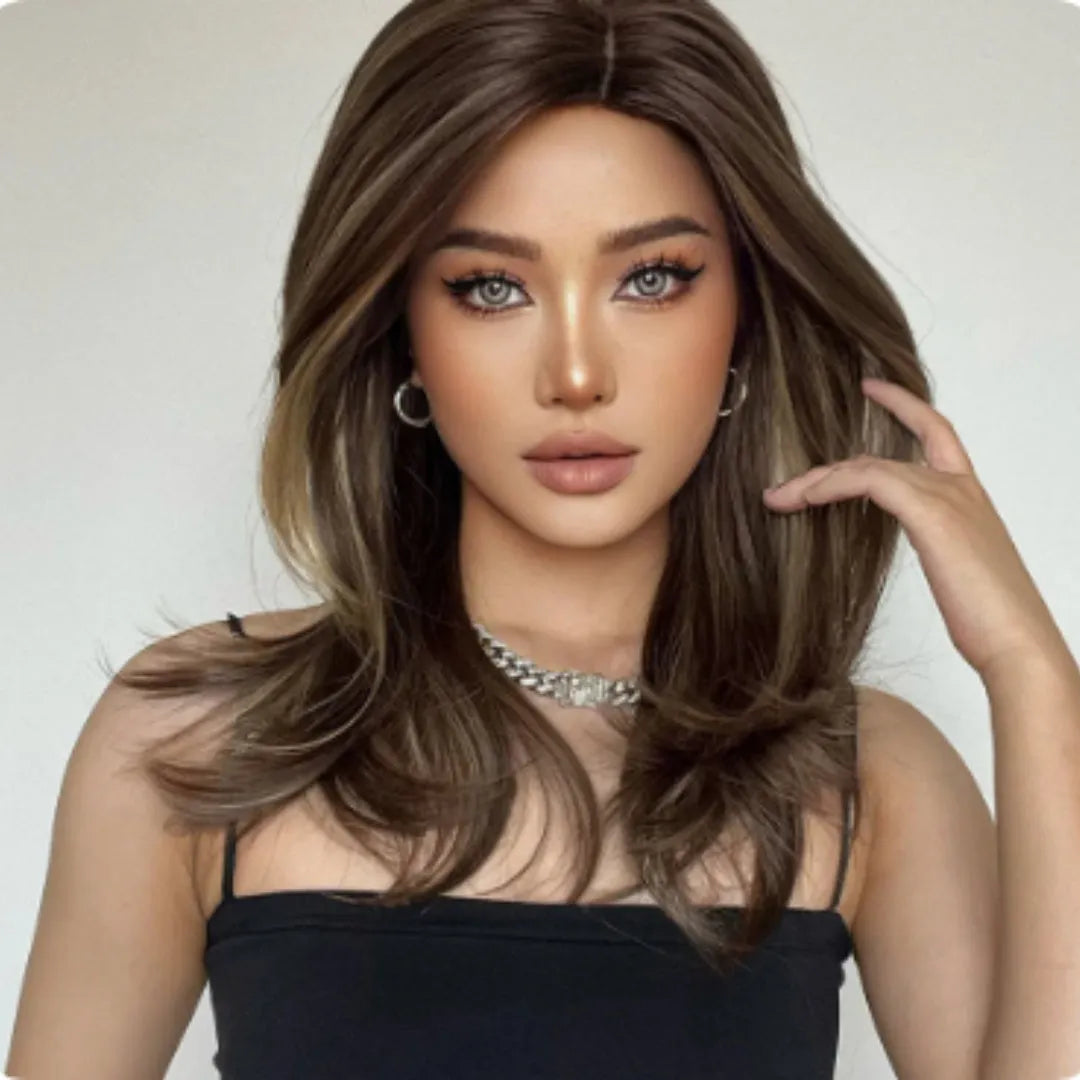Mid-length curly synthetic wig with long bangs in a gradient colour.