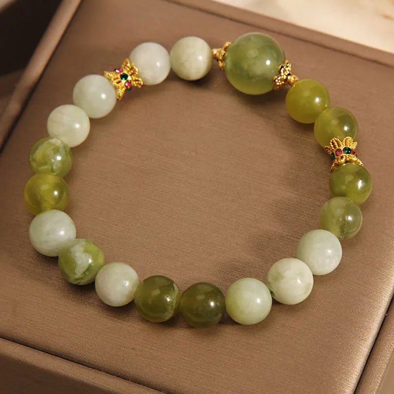 Xiuyan jade green mori-style women's bracelet with original design on a white background.