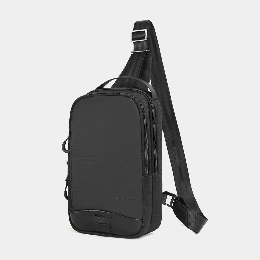 Casual black TPU camouflage chest bag with adjustable strap and front sandwich pocket on a person.