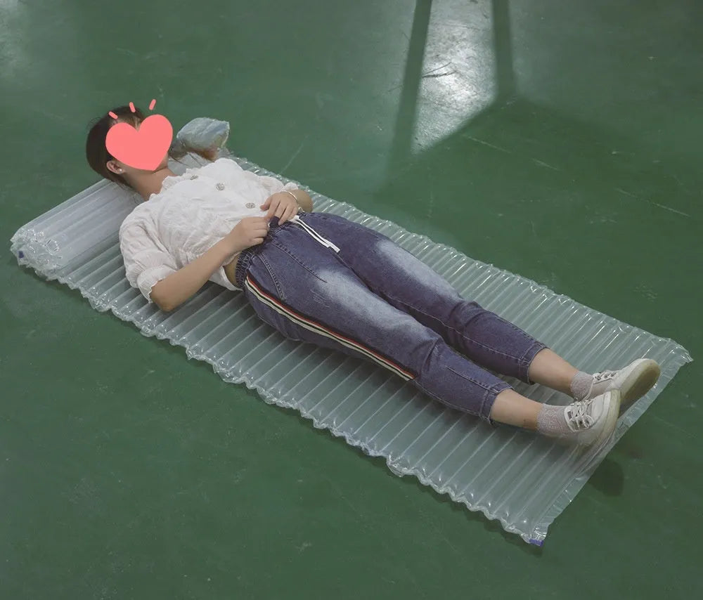 Transparent outdoor inflatable airbed measuring 200cm long by 60cm wide.