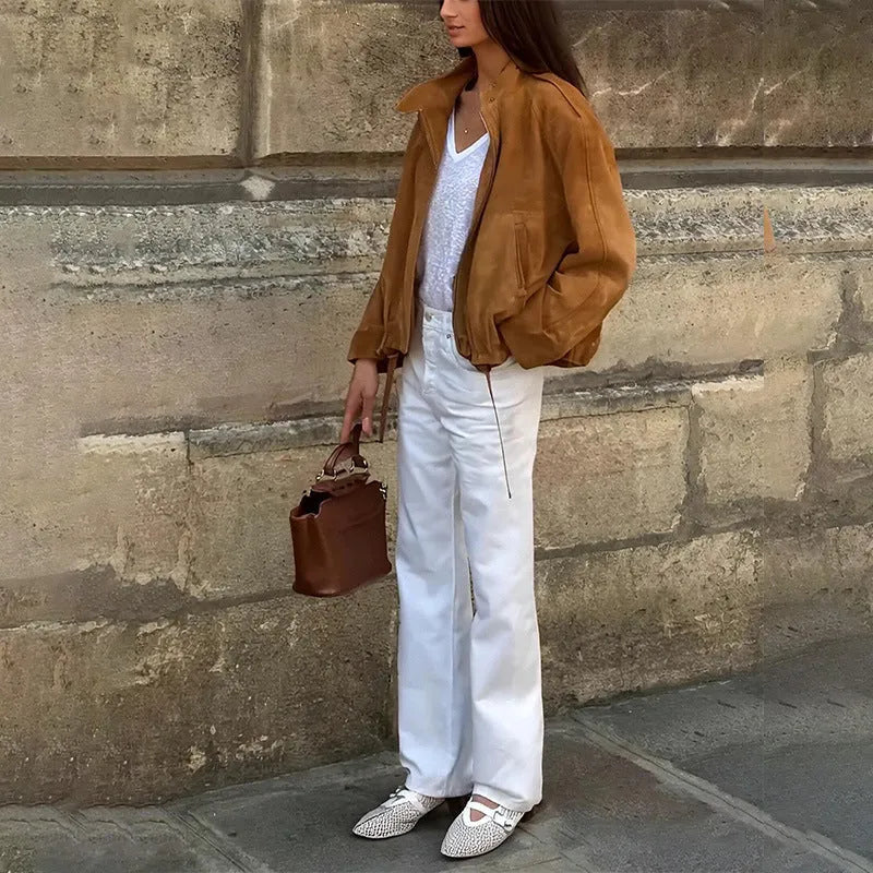 Retro solid colour loose fit polyester jacket on a hanger, showing long sleeves.