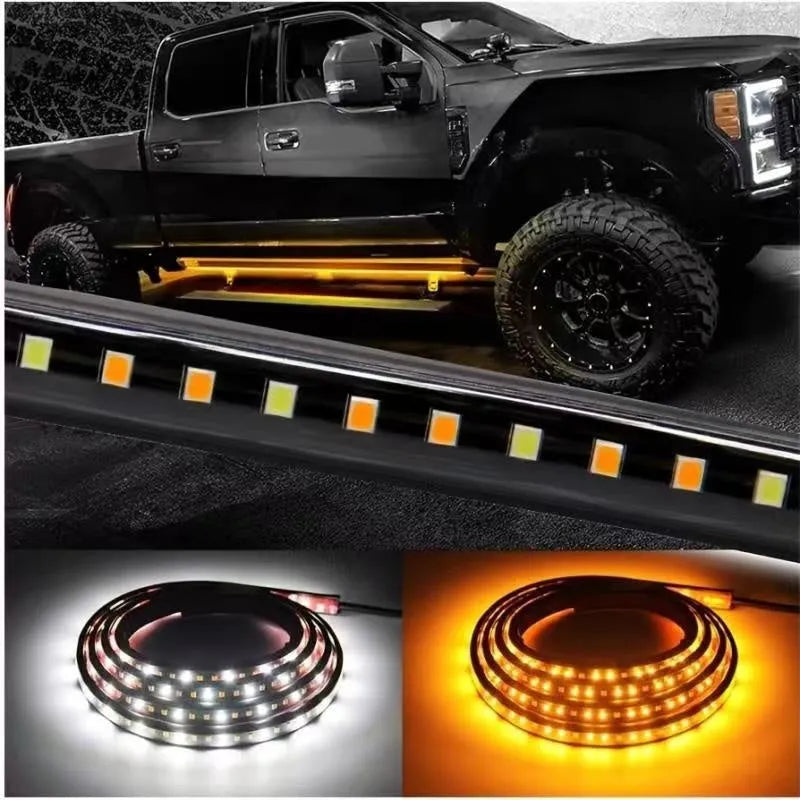 Pair of yellow pedal streamer side light lamps in flexible PVC casing on a dark background