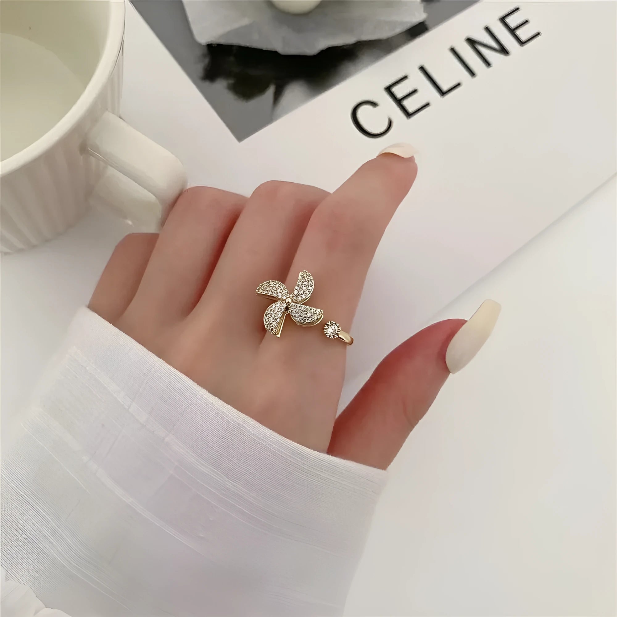 Gold and silver rotating ring with micro-inlaid geometric design on a copper band.