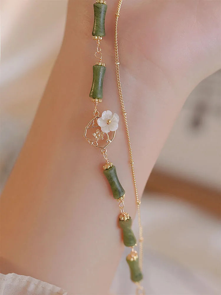 Handmade natural olivine bracelet with Chinese double layer design and olive branch motif.