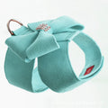 Cute pink bowknot chest strap for a small dog on a white background.