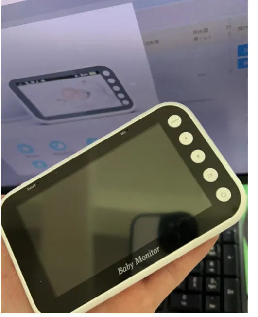 43 inch baby monitor with 4.3 inch LCD screen showing video feed of baby sleeping