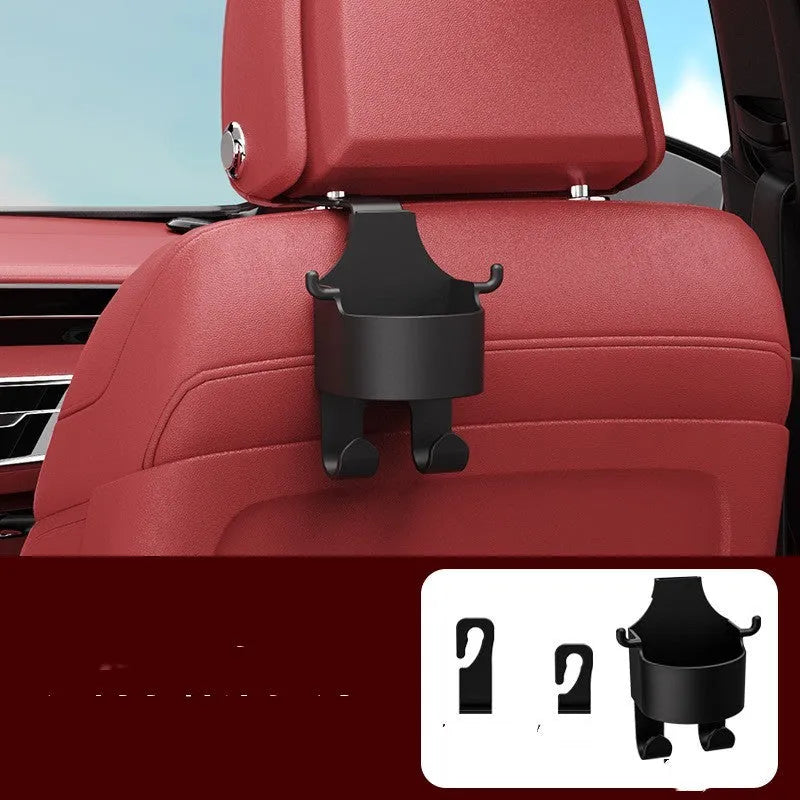 Black plastic car seat back organiser with cup holder and storage hook mounted on headrest
