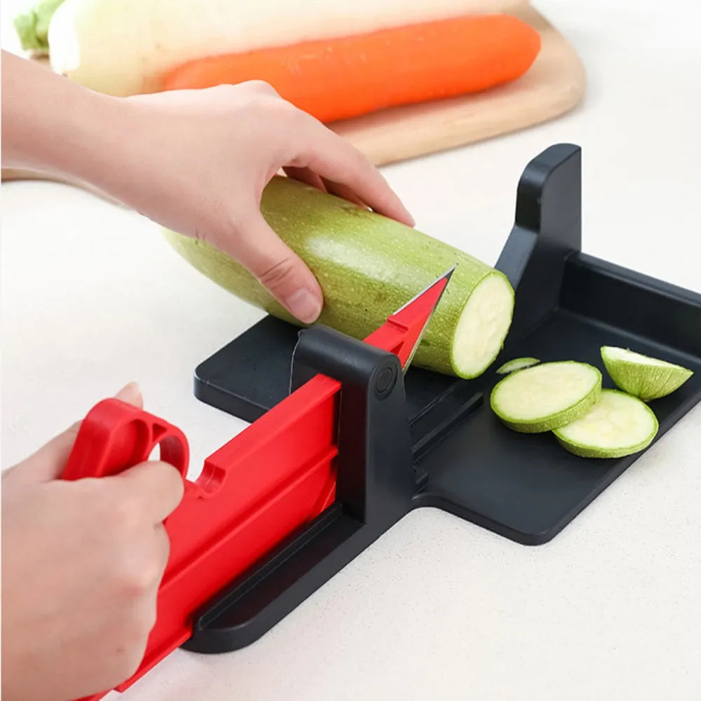 Green and red modern vegetable cutter with stainless steel blades for cutting carrots and potatoes.