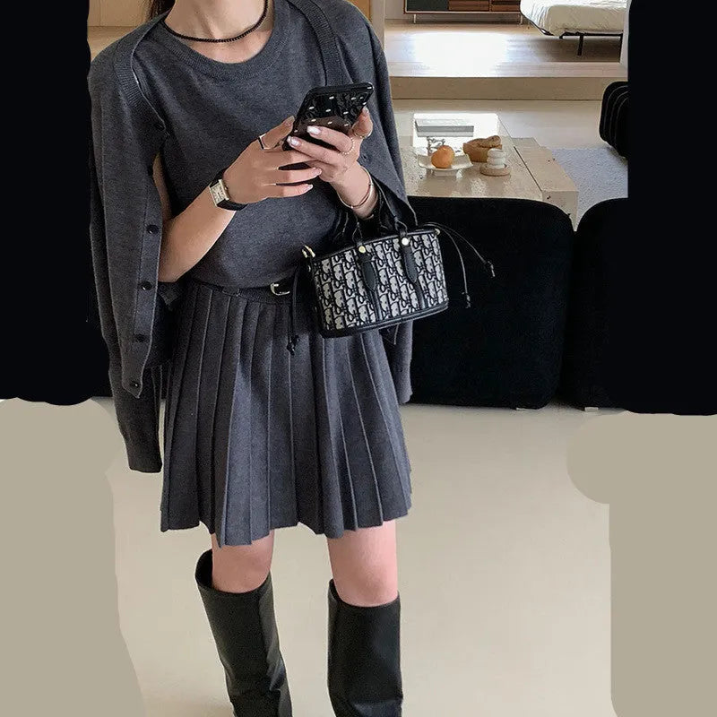 Grey art retro knitted two-piece set with 3D pattern, featuring a pleated vest skirt and long-sleeved cardigan with an adjustable belt.