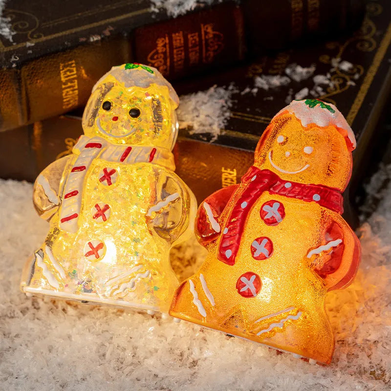 Glowing plastic gingerbread man Christmas ornament with LED light and scarf, in four colour variations.