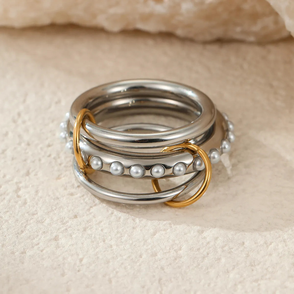 Stacked colour matching stainless steel ring with 18K gold plating, exaggerated design