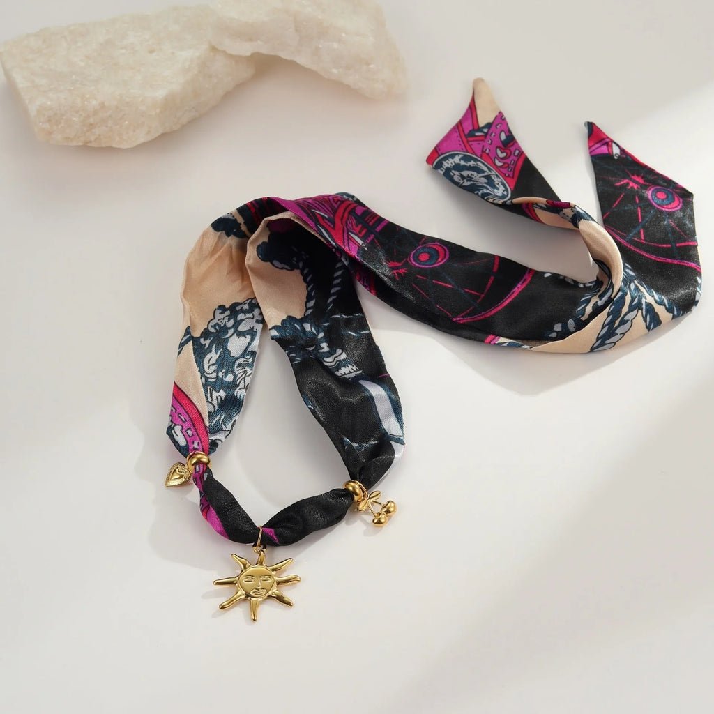 Geometric pendant on a stainless steel chain, available as a necklace or bracelet.