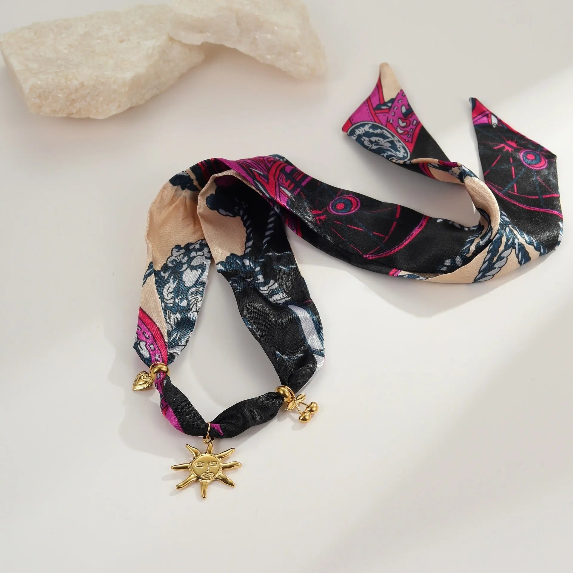 Geometric pendant on a stainless steel chain, available as a necklace or bracelet.