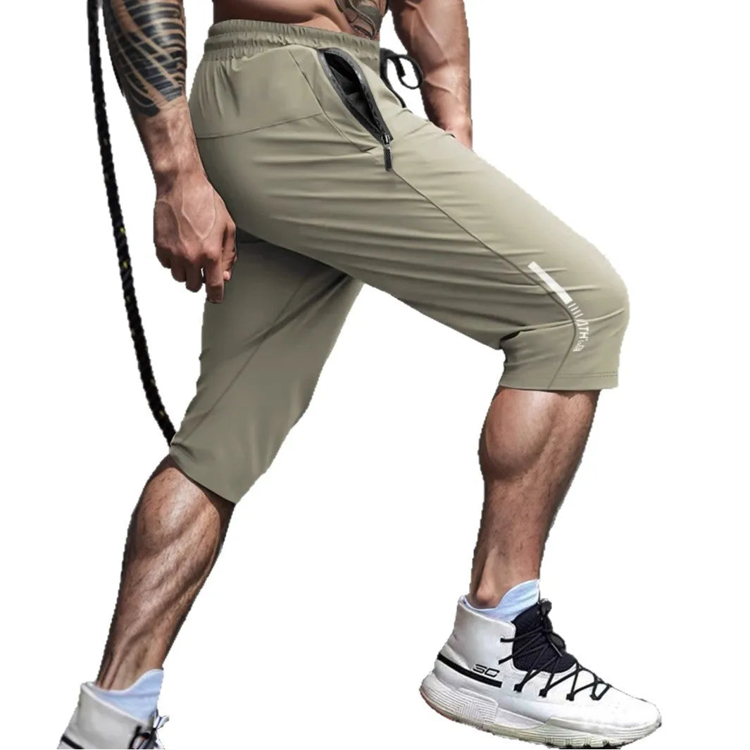 Men's black cropped sports pants with straight-leg cut and quick-drying nylon fabric