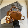 American retro PU leather bowling bag in brown with pendant and crossbody strap