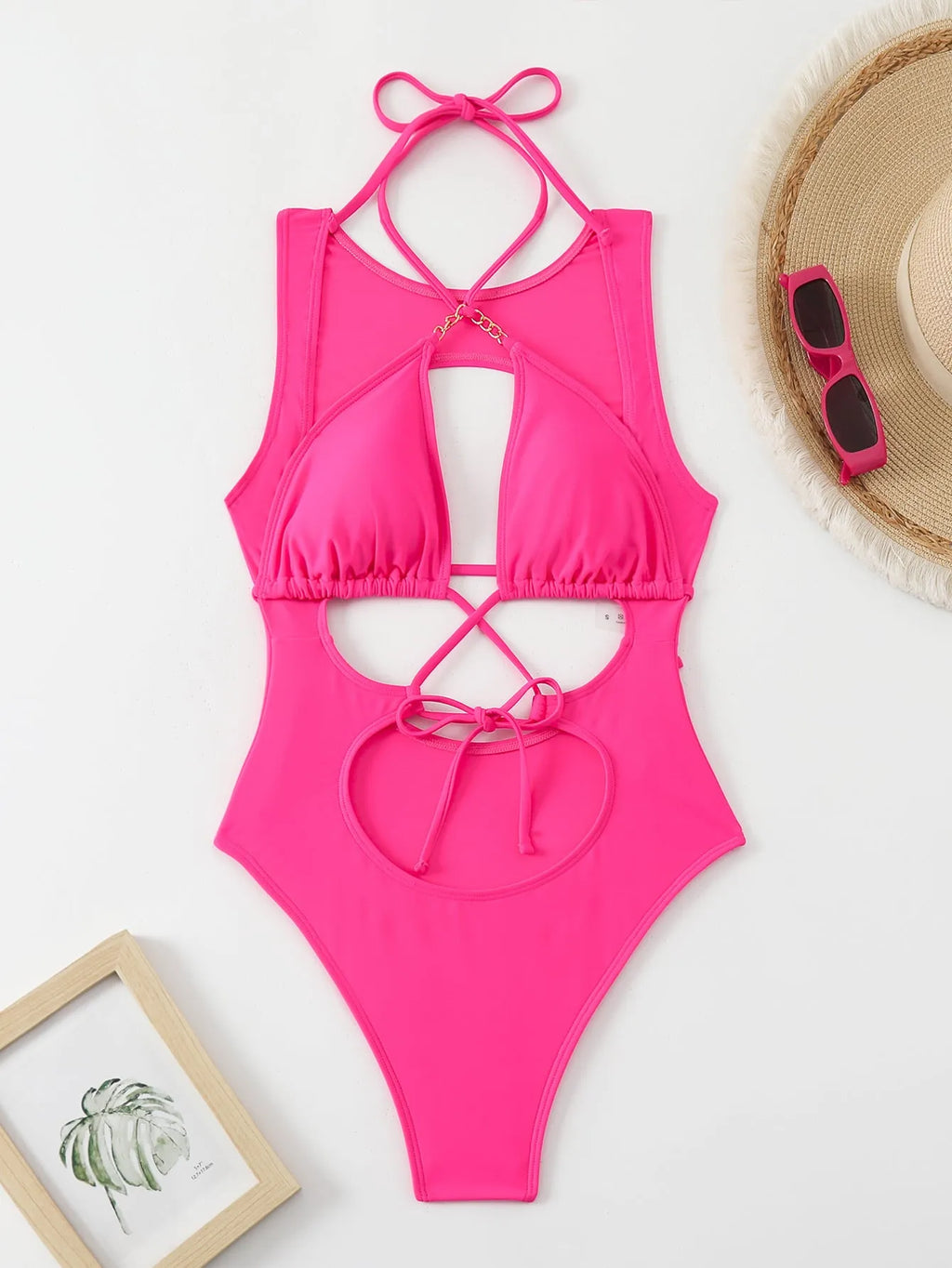 Bright pink women's one-piece swimsuit with cutout strap design, nylon fabric, sizes S M L