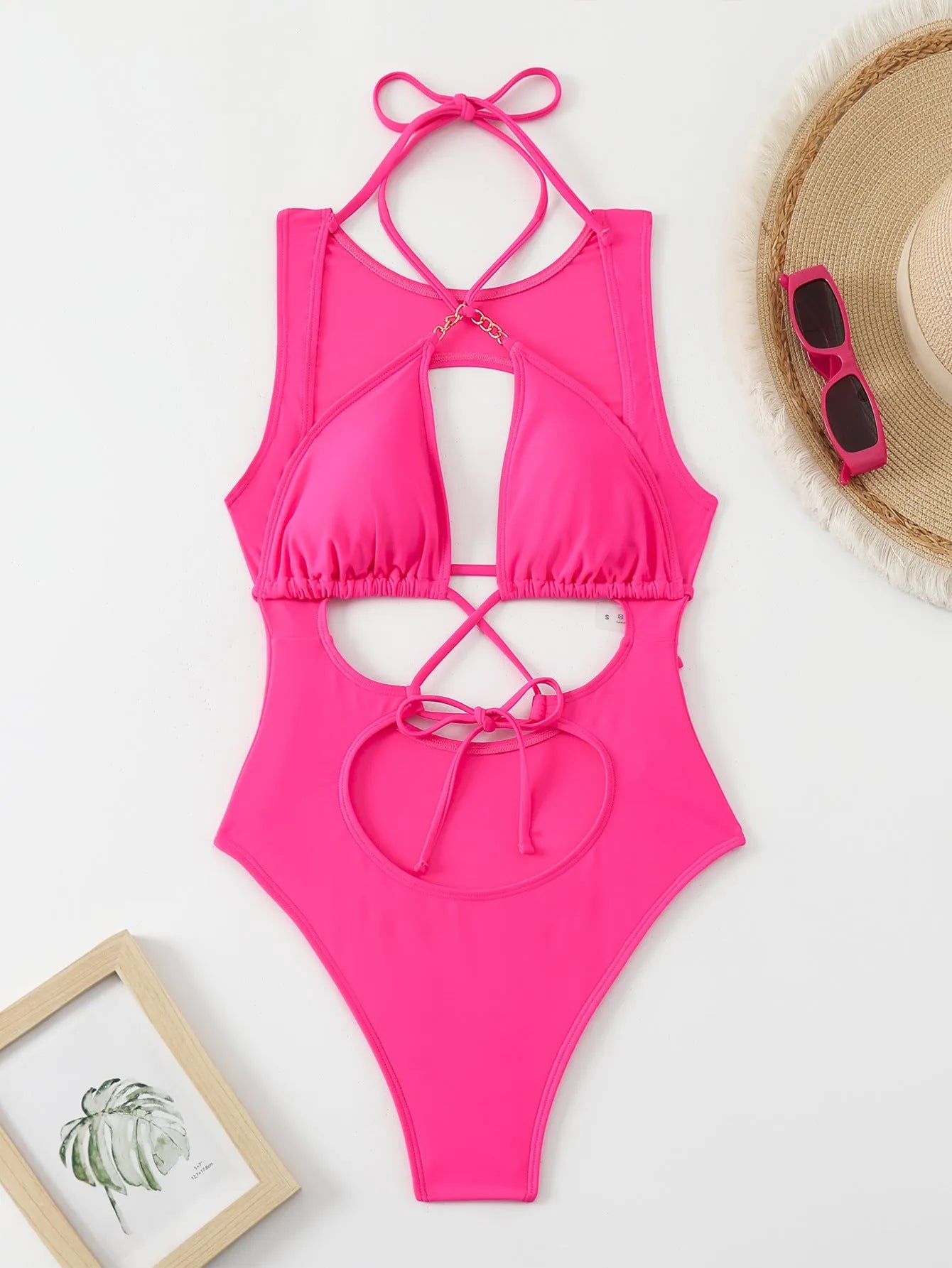 Bright pink women's one-piece swimsuit with cutout strap design, nylon fabric, sizes S M L