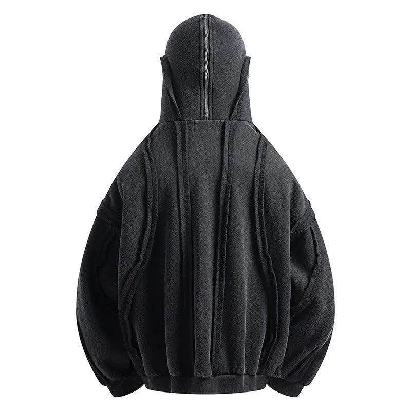 Black loose-fit zip-up hooded coat with an abstract pattern and padding worn as an autumn layer.