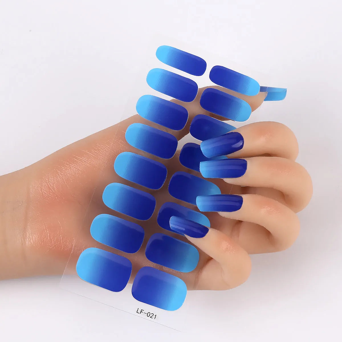 16 solid colour full nail art stickers with 22 patterns including cross, rose, butterfly designs in 12x6mm oval size