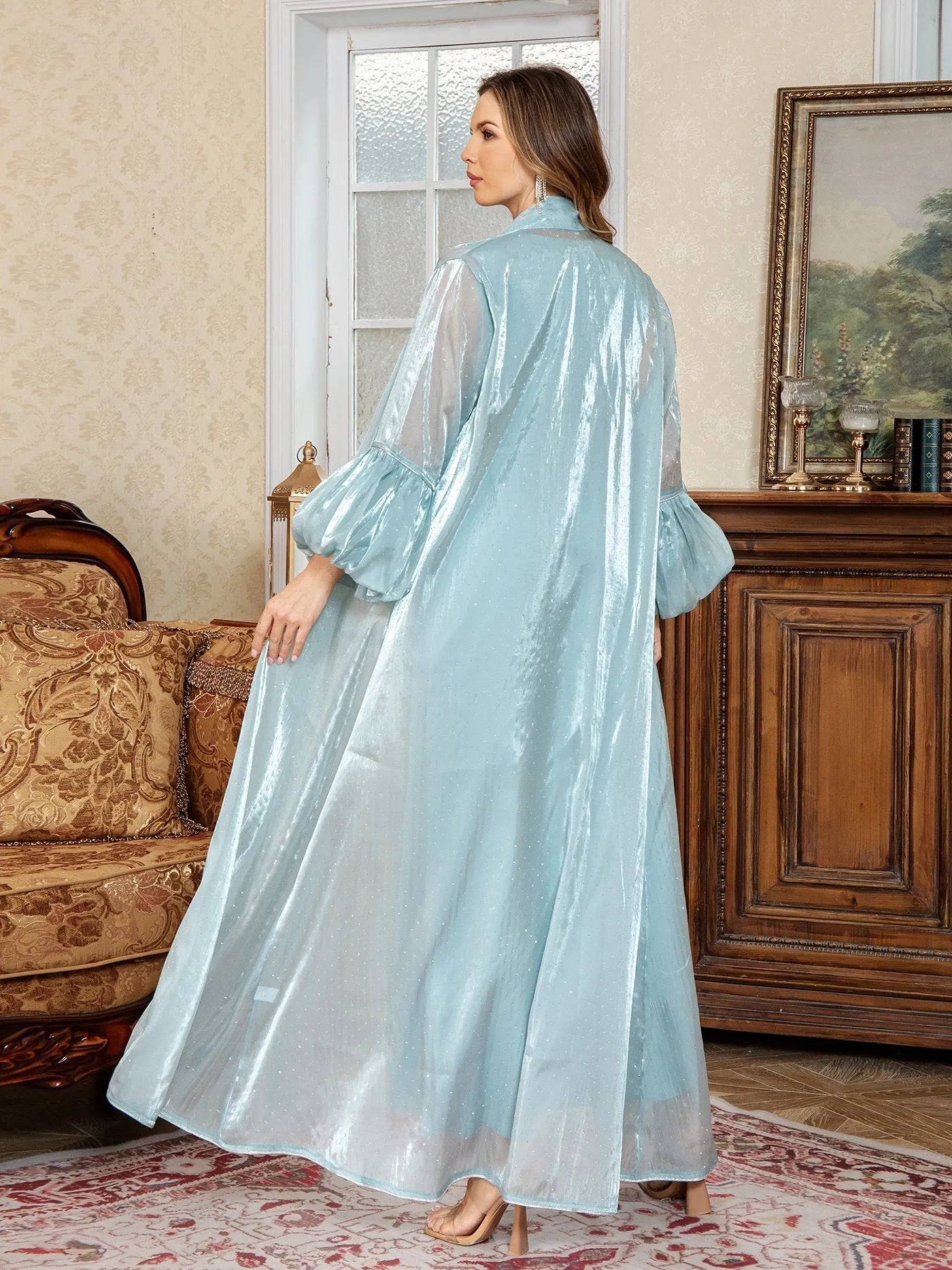 Brown Arabic two-piece dress with long sleeves, rhinestone detailing, and full-length skirt