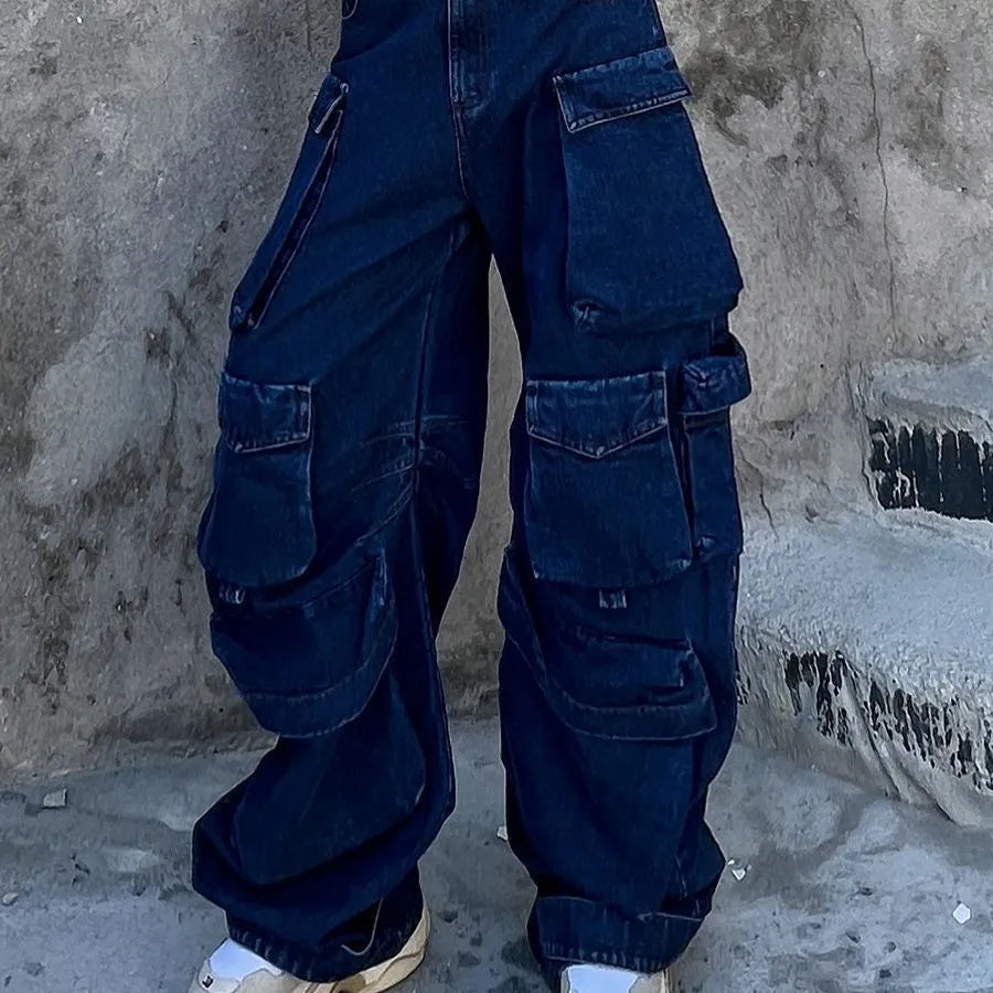 Dark blue distressed women's wide-leg jeans with a high waist and multiple pockets on a neutral background.
