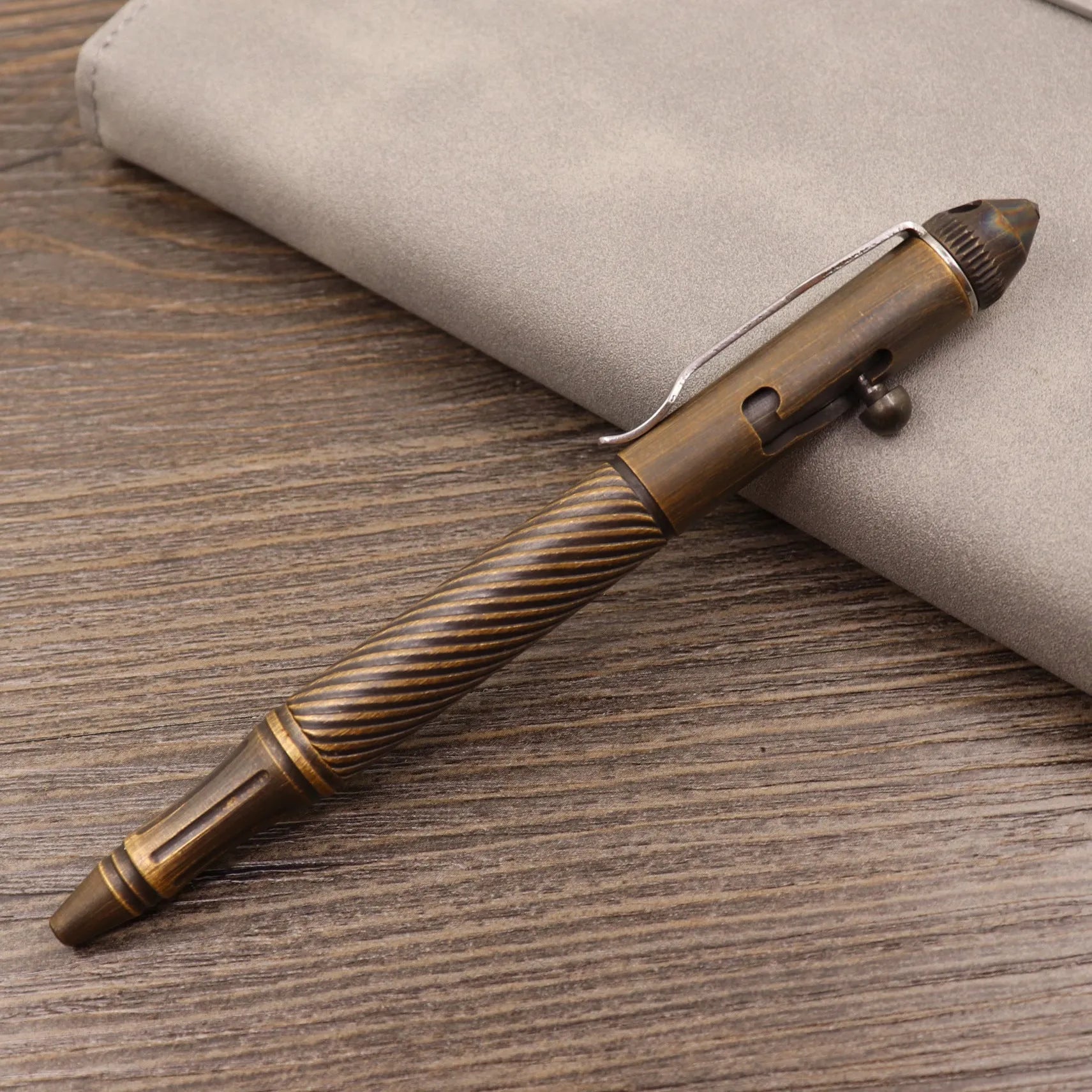 Brass tactical pen with retro colour finish and press mechanism