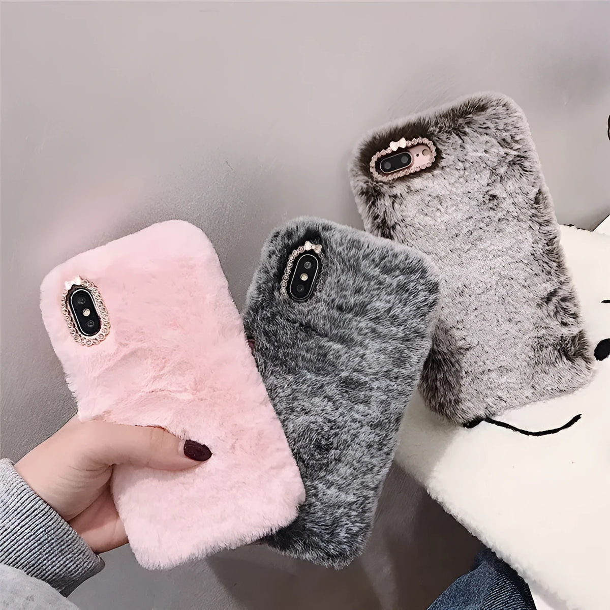 Rabbit hair silicone iPhone case with rhinestone detail, back cover in grey brown or pink plush for Apple iPhone models.