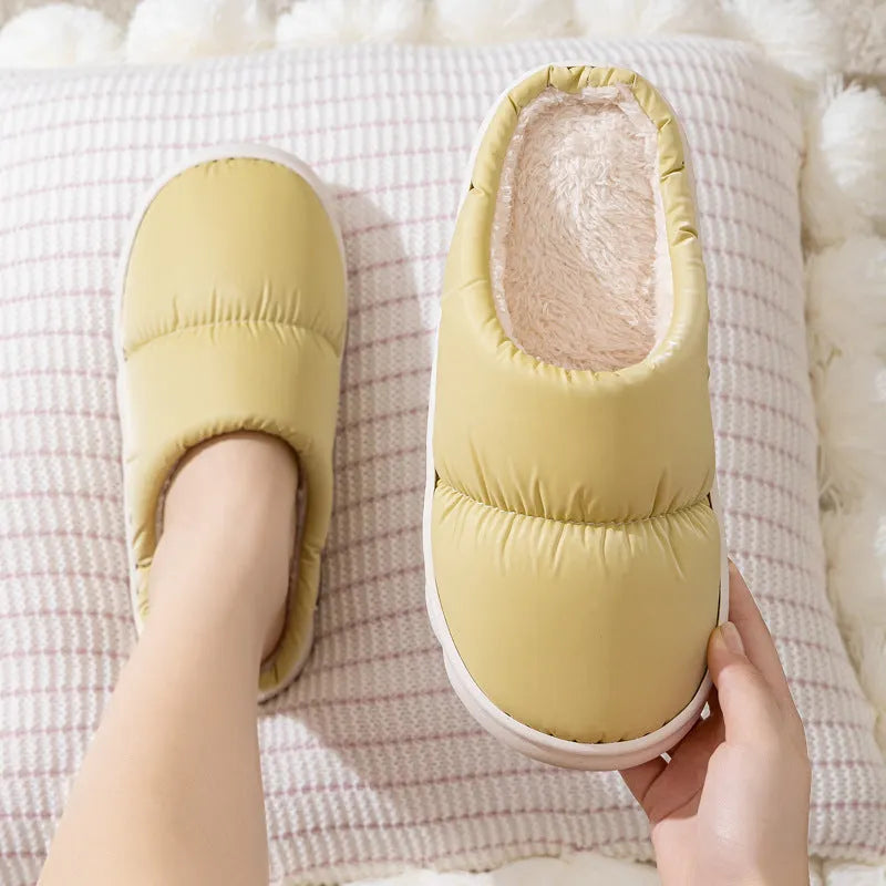 Pair of down cotton slippers with artificial leather upper and thick rubber sole, shown in available colours.