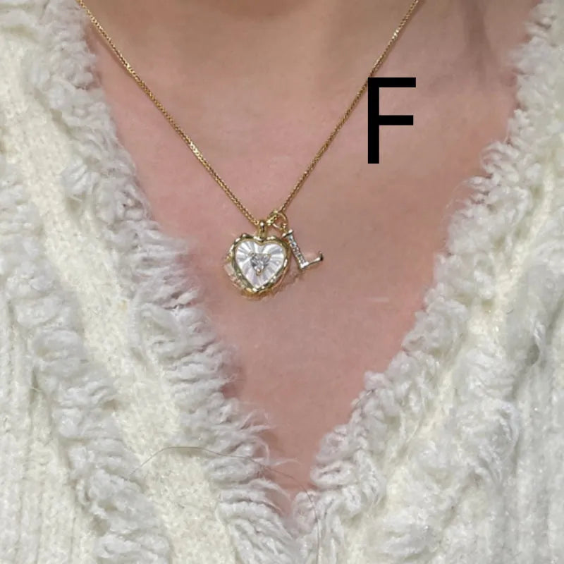 Women's pendant necklace with titanium steel chain and natural mother-of-pearl in heart-shaped design