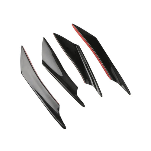 Set of four carbon fibre pattern bumper blade spoilers for car modification on a black background.